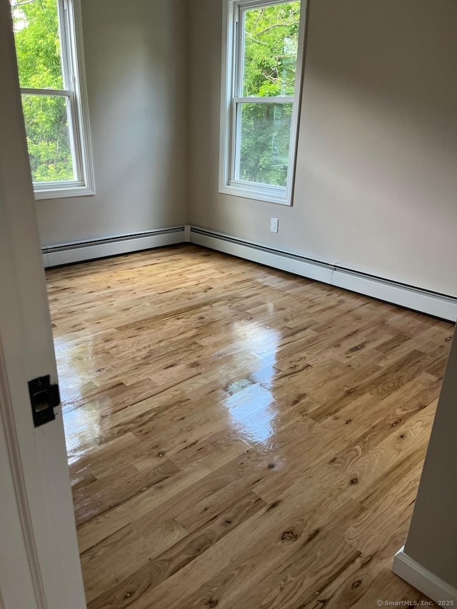 spare room with light wood-type flooring