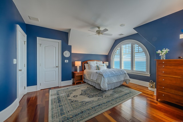 bedroom featuring wood-type flooring, vaulted ceiling, and ceiling fan