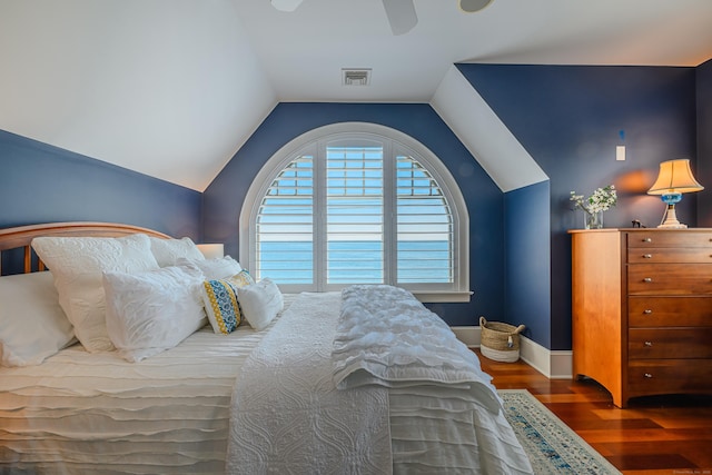 bedroom with ceiling fan, dark hardwood / wood-style flooring, and vaulted ceiling