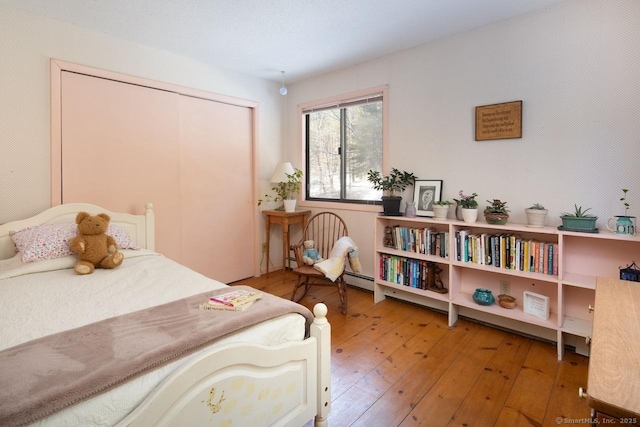 bedroom with hardwood / wood-style flooring