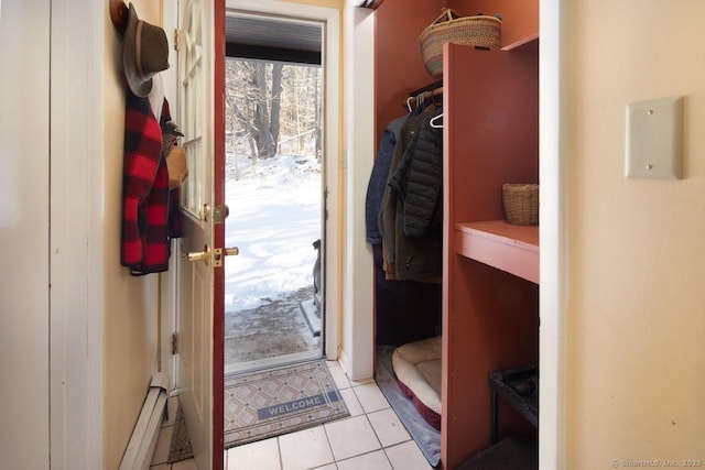 doorway to outside with light tile patterned floors