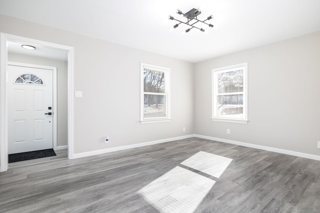 entryway with hardwood / wood-style floors