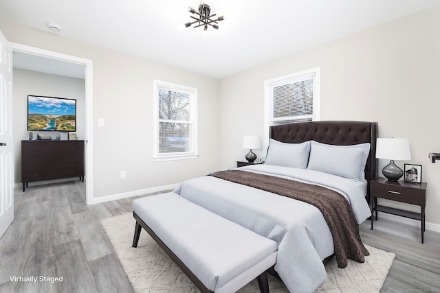 bedroom with light hardwood / wood-style flooring