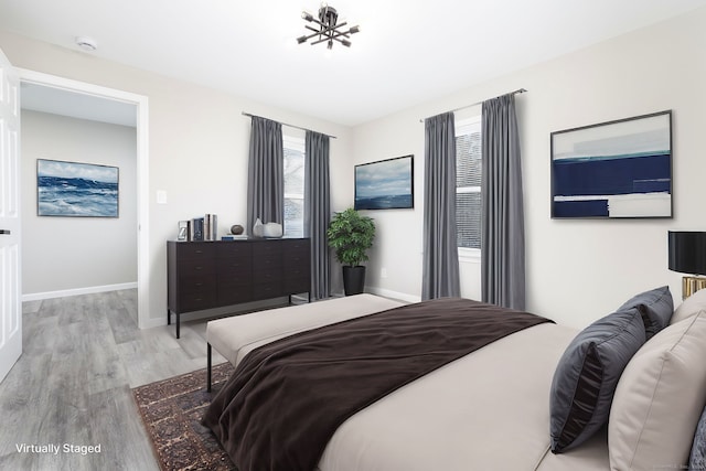 bedroom with light hardwood / wood-style floors