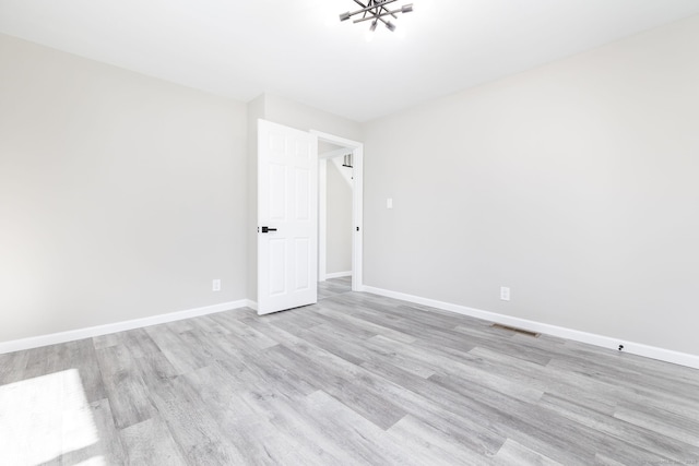 unfurnished room featuring light hardwood / wood-style flooring