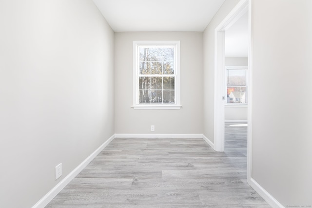 spare room with light wood-type flooring