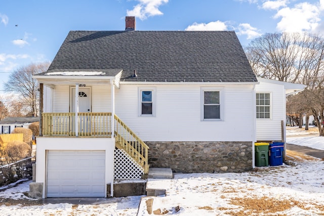 front facade with a garage and a porch