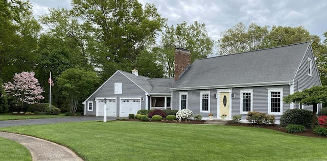 cape cod-style house with a garage and a front yard