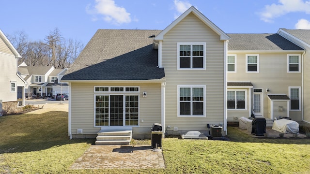 back of house featuring a patio, central AC, and a lawn