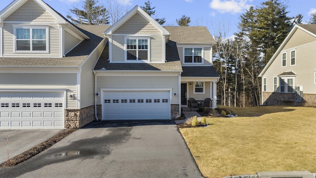 view of front of house with a garage and a front yard