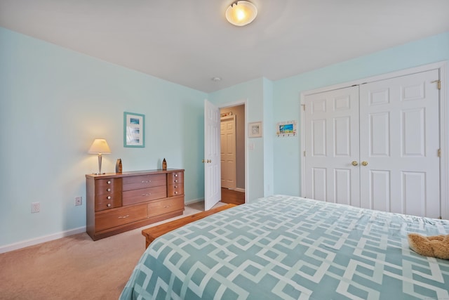 carpeted bedroom with a closet