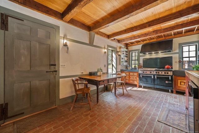 home office featuring beamed ceiling and wooden ceiling