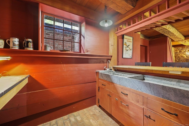 bar featuring wood ceiling and wood walls