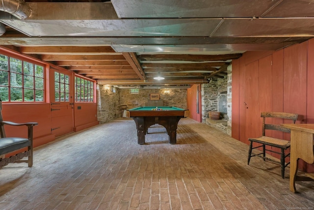 recreation room with beamed ceiling, pool table, and wooden walls