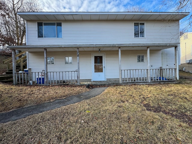 rear view of house with covered porch