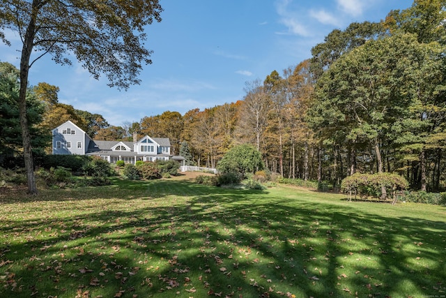 view of yard with a view of trees