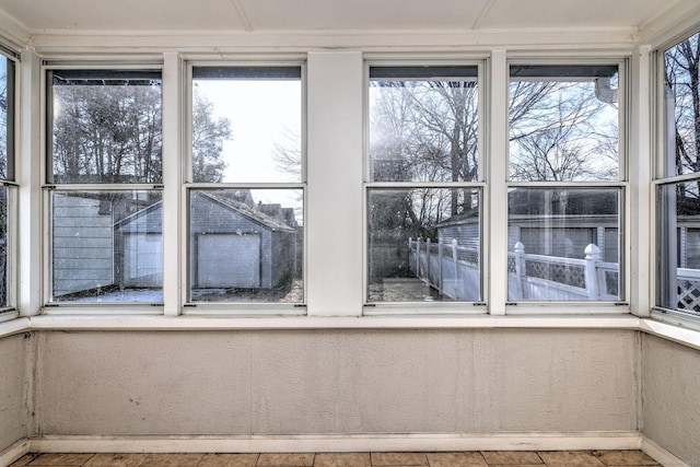 unfurnished sunroom featuring a healthy amount of sunlight