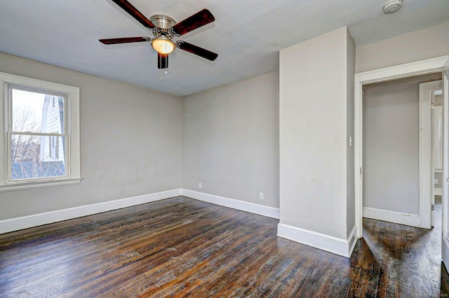 unfurnished bedroom featuring ceiling fan and dark hardwood / wood-style floors