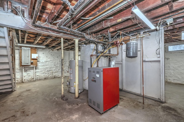 basement with water heater and electric panel