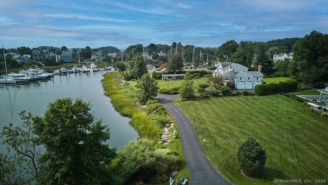 birds eye view of property with a water view