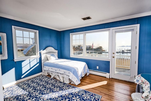 bedroom featuring crown molding, a baseboard radiator, access to exterior, and hardwood / wood-style flooring