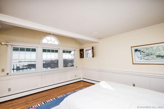 bedroom with hardwood / wood-style floors, a baseboard radiator, lofted ceiling, ornamental molding, and a water view