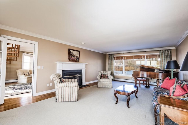 living room with a baseboard heating unit, hardwood / wood-style flooring, and ornamental molding