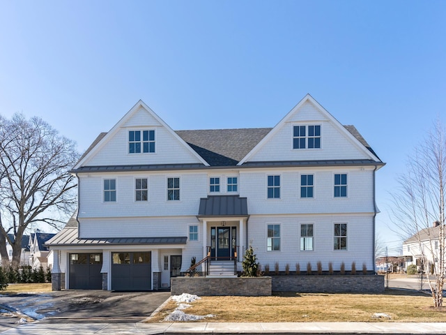 modern inspired farmhouse with a garage