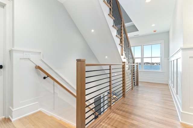 stairway featuring wood-type flooring