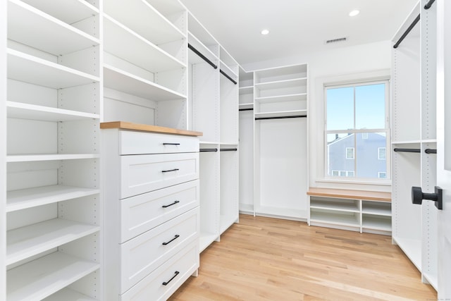 spacious closet featuring visible vents and light wood finished floors