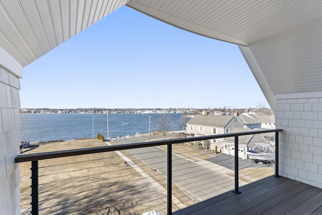 wooden deck with a water view