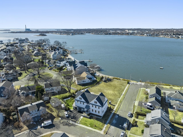 birds eye view of property with a water view and a residential view