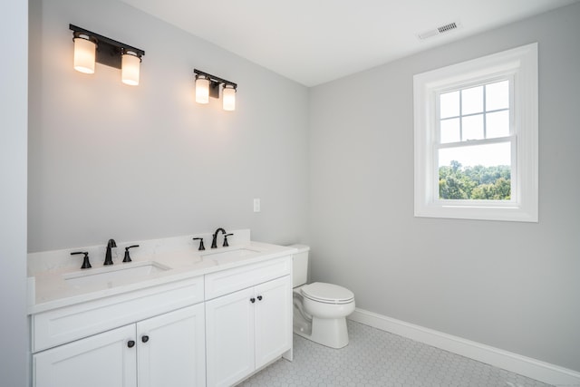 bathroom with vanity and toilet