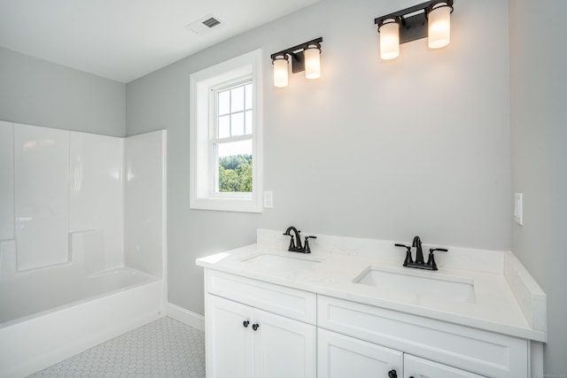 bathroom featuring vanity and shower / washtub combination