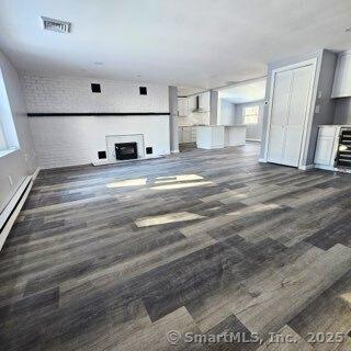 unfurnished living room featuring a fireplace