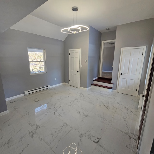 interior space featuring vaulted ceiling and baseboard heating