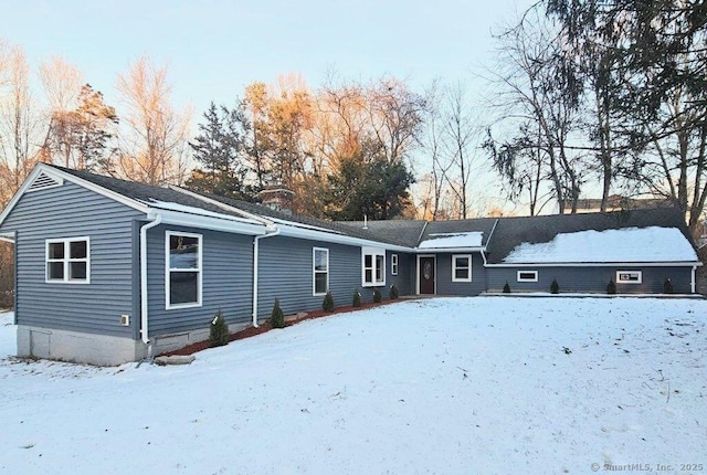 view of snow covered house