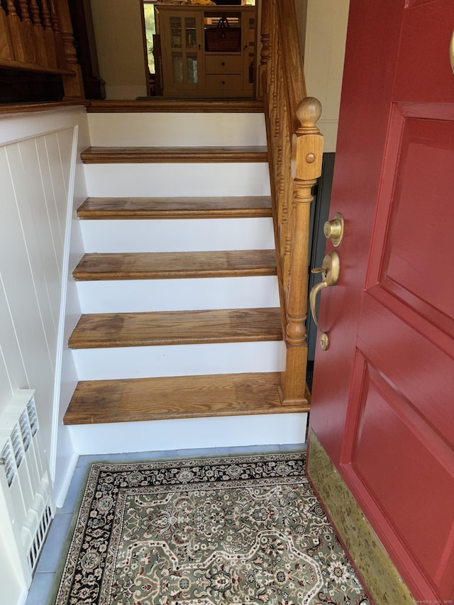 stairs featuring tile patterned flooring