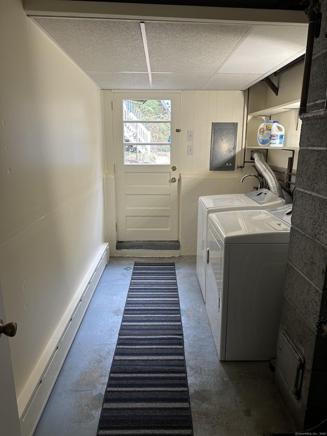 laundry room featuring washing machine and dryer and baseboard heating