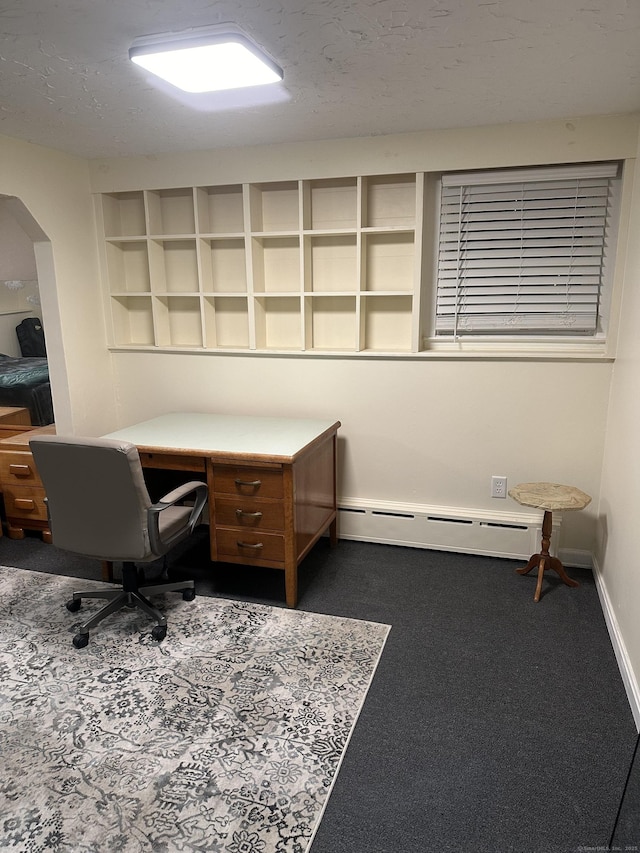 carpeted home office with baseboard heating