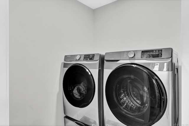 laundry area featuring washing machine and clothes dryer