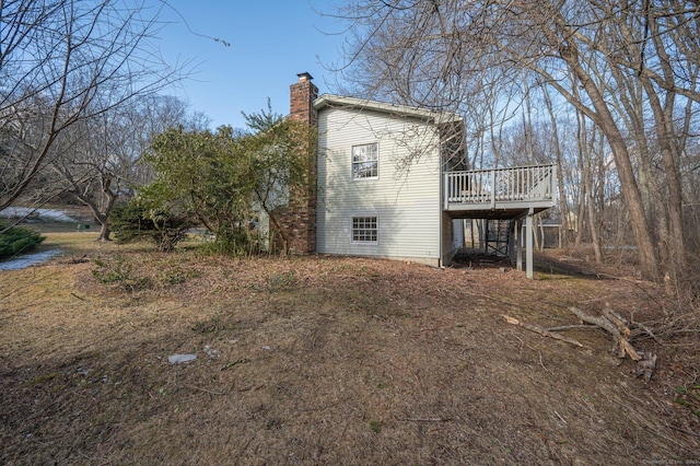 view of side of property featuring a deck