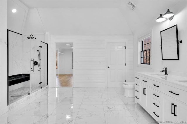 bathroom featuring toilet, lofted ceiling, vanity, and walk in shower