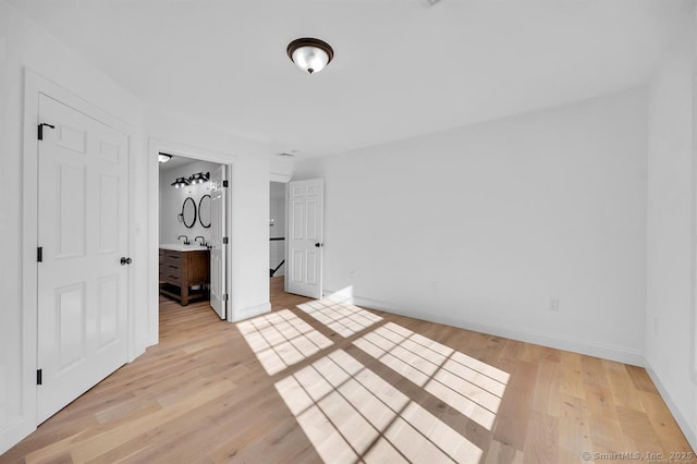 unfurnished bedroom with light hardwood / wood-style flooring