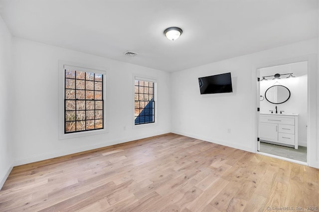 spare room featuring light hardwood / wood-style floors