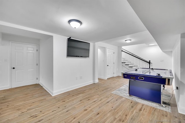 recreation room featuring light hardwood / wood-style flooring