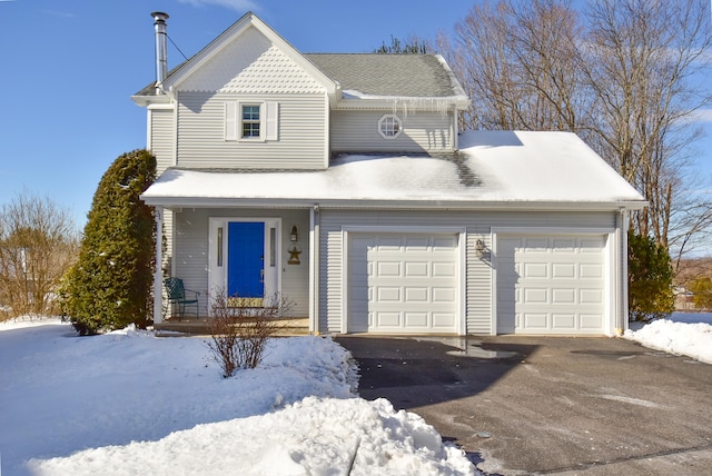 view of front of property with a shingled roof, driveway, and an attached garage