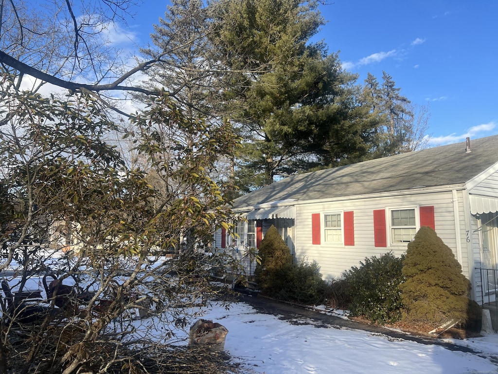 view of snow covered property