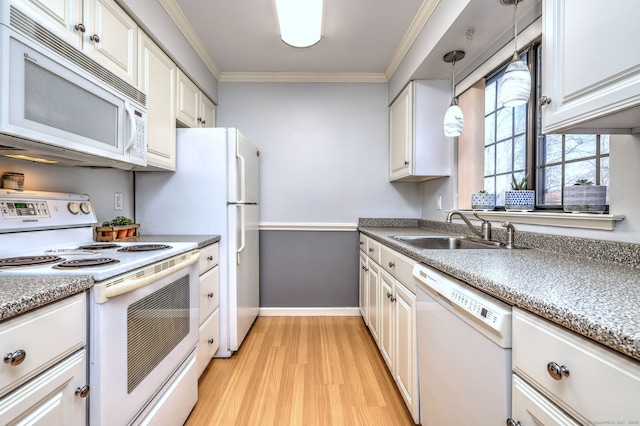 kitchen with sink, white cabinetry, ornamental molding, pendant lighting, and white appliances