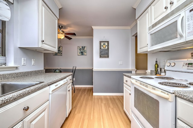 kitchen featuring crown molding, ceiling fan, white appliances, and white cabinets